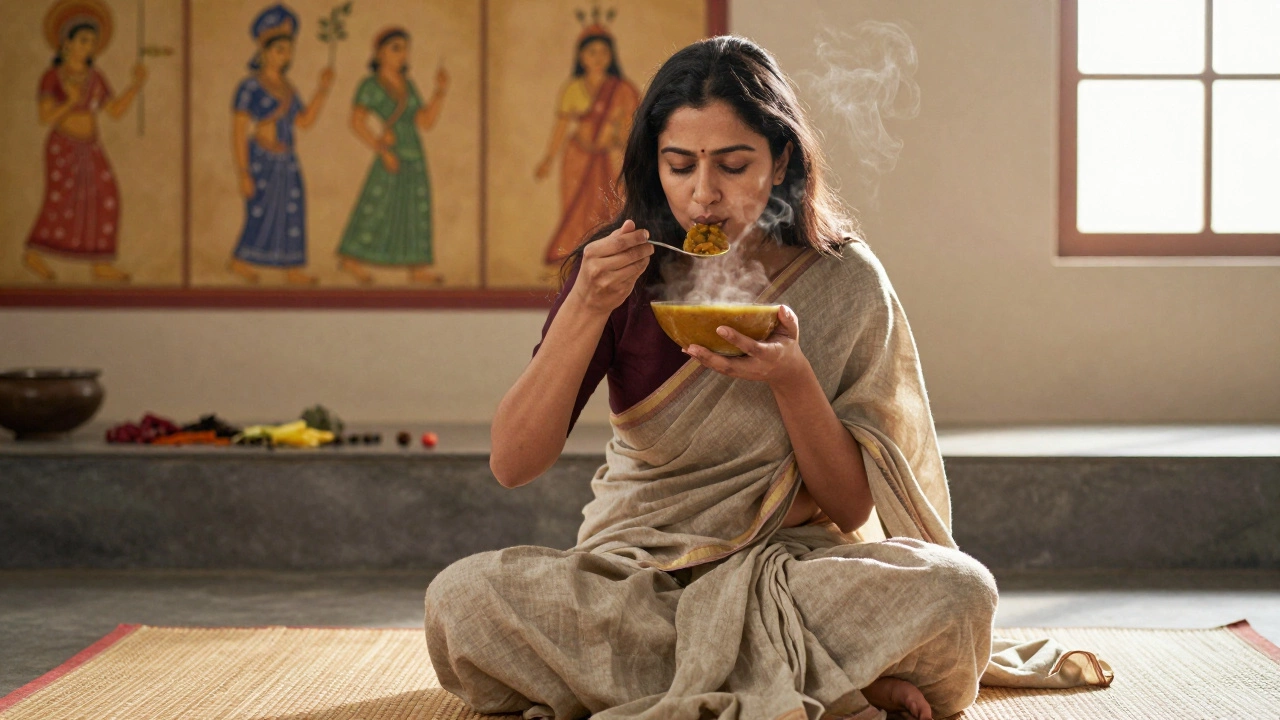 A woman meditatively eating lentil soup in a sunlit Indian kitchen with herbal spices nearby.